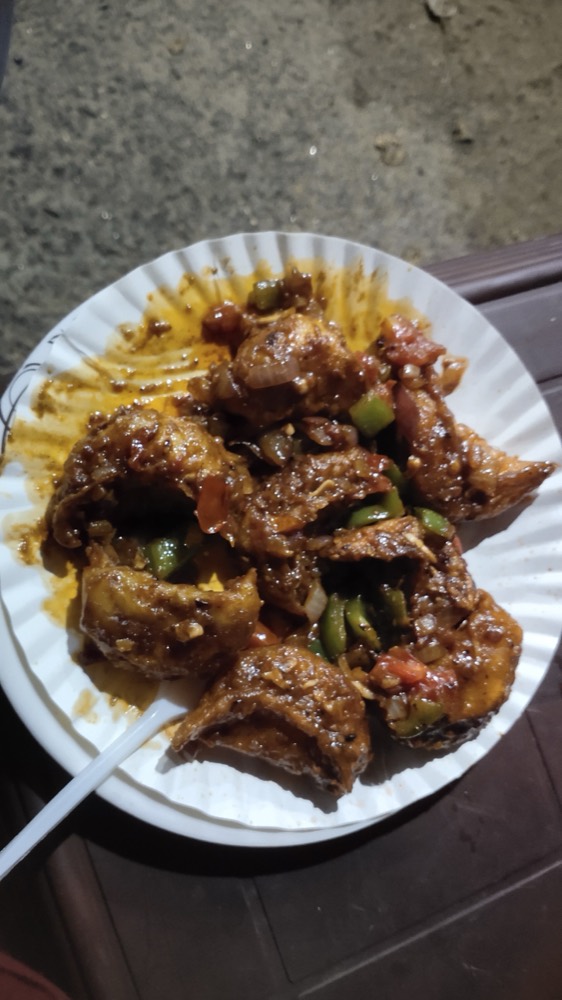 Momos coated with a balanced chilli sauce